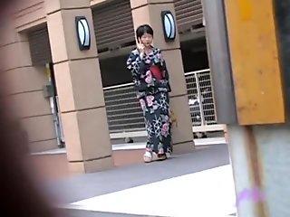 Black-haired small geisha flashes her tits when someone pulls her outfit